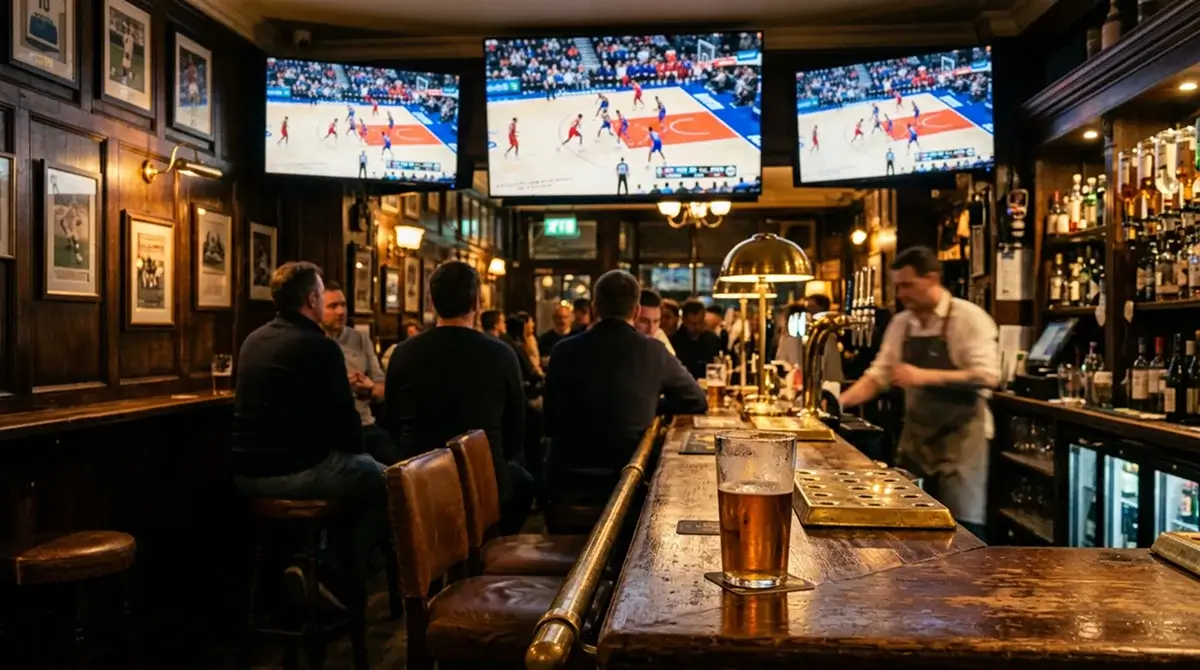 UK sports bar evening with NBA game on multiple screens